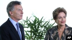 Brazil’s President Dilma Rousseff receives Argentina's President-elect Mauricio Macri at the Planalto Presidential Palace, in Brasilia, Brazil, Dec. 4, 2015. 