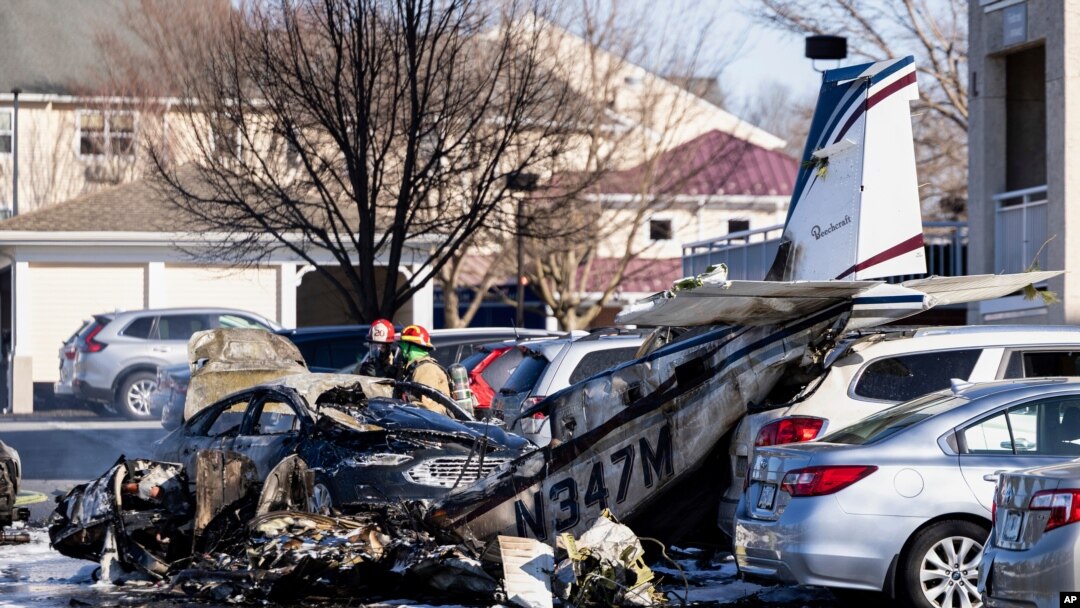 First responders work the scene after a plane crashed in the parking lot of a retirement community in Manheim Township, Pa., March 9, 2025. 