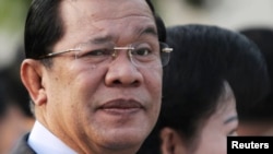 FILE - Cambodian Prime Minister Hun Sen (L) at Koh Pich island in Phnom Penh.