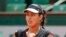 Serbia's Ana Ivanovic clenches her fist after scoring a point as she plays Ukraine's Elina Svitolina during their quarterfinal match of the French Open tennis tournament in Paris, France
