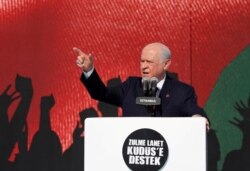 FILE - Nationalist Movement Party (MHP) leader Devlet Bahceli delivers a speech in Istanbul, Turkey, May 18, 2018.