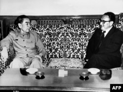 FILE - U.S. Special Envoy Henry Kissinger, right, meets with China's Prime Minister Zhou Enlai, in Beijing, July 1971.