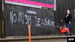 Graffiti in a loyalist area of south Belfast against an Irish sea border is seen Feb. 2, 2021. 