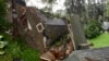 A crushed house is seen in the aftermath of a mudslide that destroyed three homes on a hillside in Sausalito, Calif., Feb. 14, 2019. 