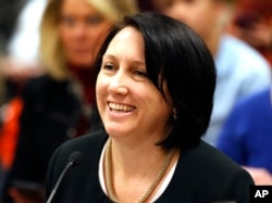 Republican Rep. Karianne Lisonbee speaks during a committee hearing at the Utah State Capitol, Jan. 25, 2018, in Salt Lake City. A committee of Utah lawmakers has pushed forward a bill that would bar doctors from performing abortions sought because the fetus has Down syndrome.