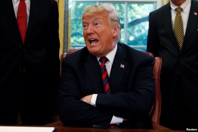 U.S. President Donald Trump talks to reporters about the killing of Saudi journalist Jamal Khashoggi in Turkey, at the White House in Washington, Oct. 23, 2018.