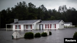 A house is seen flooded by rain after Hurricane Florence swept through the town of Wallace, North Carolina, Sept. 15, 2018. 