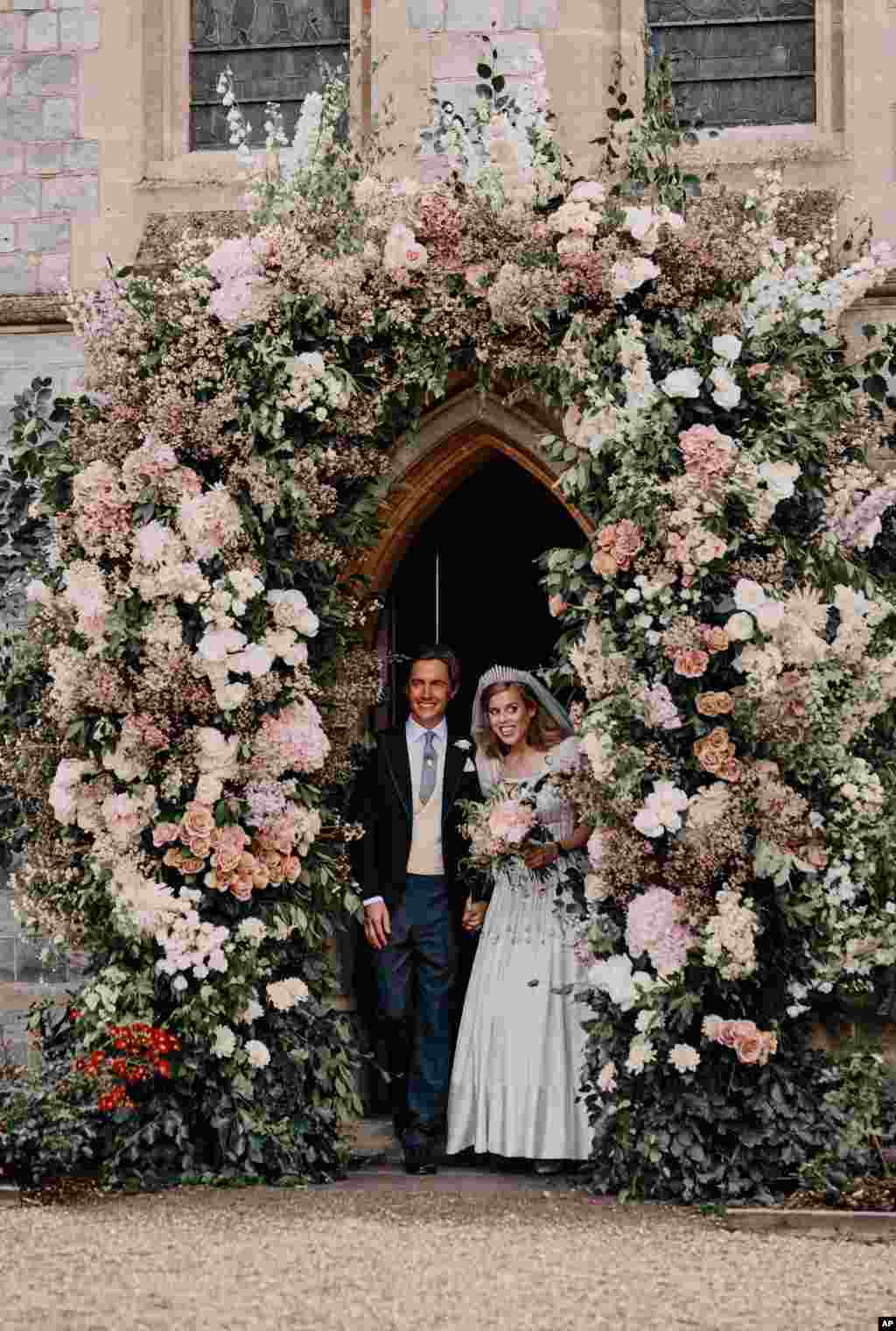 Britain&#39;s Princess Beatrice and Edoardo Mapelli Mozzi leave The Royal Chapel of All Saints at Royal Lodge in Windsor, England, after their wedding, July 18, 2020. (Photo released by the Royal Communications of Princess Beatrice and Edoardo Mapelli Mozzi)