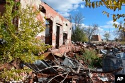 FILE - The ruins of a building that was part of a Native American boarding school on the Rosebud Sioux Reservation in Mission, South Dakota, are show here on Oct. 15, 2022.