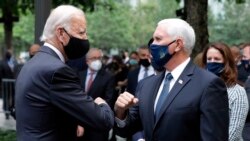 Democratic presidential candidate former Vice President Joe Biden greets Vice President Mike Pence at the 19th anniversary ceremony in observance of the Sept. 11 terrorist attacks at the National September 11 Memorial & Museum in New York, on Friday, Sept