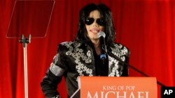 FILE - In this March 5, 2009 file photo, US singer Michael Jackson announces that he is set to play ten live concerts at the London O2 Arena in July, which he announced at a press conference at the London O2 Arena. Jackson and Sony Corp. announced Monday,