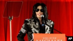 FILE - Singer Michael Jackson announces that he will play 10 live concerts in London, March 5, 2009. Forbes magazine put the King of Pop's earnings for the year ending October 1 at $825 million.