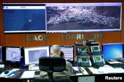 NATO personnel monitor air traffic at the Combined Air Operations Centre (CAOC) at Torrejon airbase, Spain, as part of NATO drills over Western Europe, Sept.12, 2018.