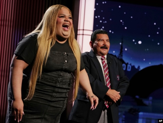 This image released by Disney shows TikTok creator Jools Lebron, left, with talk show personality Guillermo Rodriguez on the set of "Jimmy Kimmel Live!" on Monday, Aug. 19, 2024 in Los Angeles. (Randy Holmes/ABC-Disney via AP)