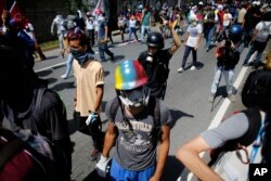 Anti-government protesters march to the Supreme Court in Caracas, Venezuela, July 6, 2017.