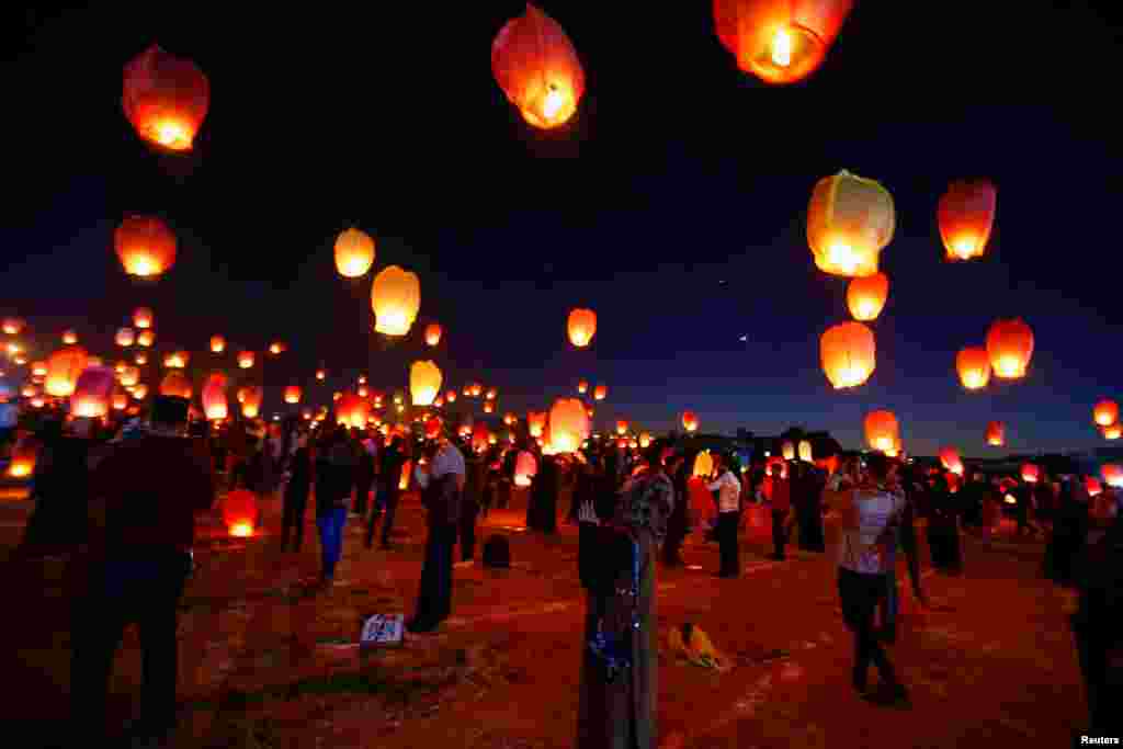 University students release balloons during a student festival in Najaf, Iraq, Dec. 28, 2019.