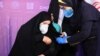 A nurse prepares to inject a volunteer taking part in an Iranian coronavirus disease (COVID-19) vaccine trial in Tehran