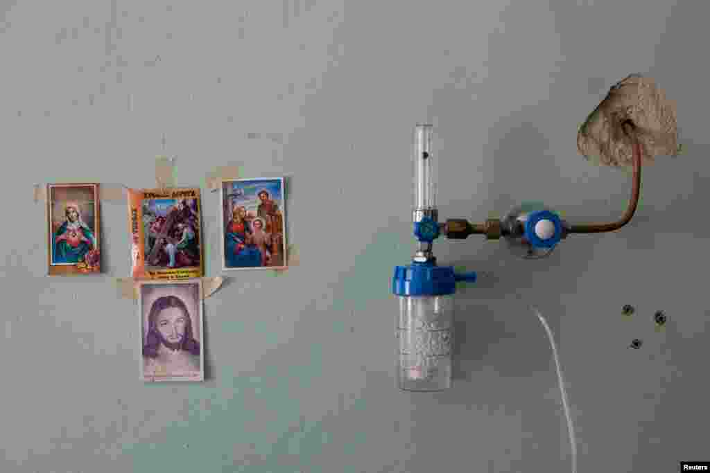 Religious images hang on the wall inside the COVID-19 ward of a hospital in Yaremche in theIvano-Frankivsk Region, Ukraine.