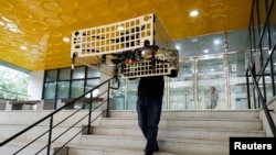 Park Hyun-geun, a graduate student of Mechanical Design and Robot Engineering at Seoul National University of Science and Technology, demonstrates the transporter drone in Seoul, South Korea, October 10, 2024. (REUTERS/Kim Soo-hyeon)