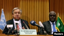 FILE - U.N. Secretary General Antonio Guterres, left, and the African Union Commission Chairperson Moussa Faki Mahamat attend a news conference at the African Union Commission headquarters in Addis Ababa, Ethiopia, July 9, 2018. 