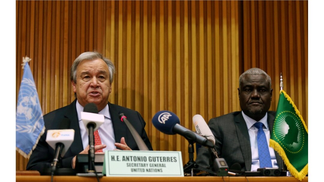 FILE - U.N. Secretary General Antonio Guterres, left, and the African Union Commission Chairperson Moussa Faki Mahamat attend a news conference at the African Union Commission headquarters in Addis Ababa, Ethiopia, July 9, 2018.