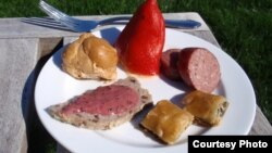 Crayfish stuff piquillo pepper, sorrel smoked salmon puff, wild turkey terrine with blackberry mustard, dandelion spanakopita and wild board bratwurst. (Tom Banse)