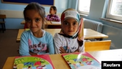 Syrian refugee children in their classroom at Fatih Sultan Mehmet School in the Karapurcek district of Ankara, Turkey, Sept. 28, 2015.