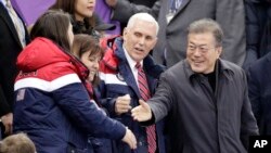 United States' Vice President Mike Pence and South Korean President Moon Jae-in attend the ladies' 500 meters short-track speedskating in the Gangneung Ice Arena at the 2018 Winter Olympics in Gangneung, South Korea, Feb. 10, 2018.