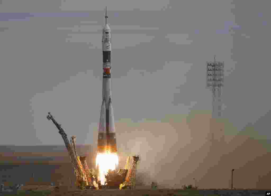 The Soyuz-FG rocket booster with Soyuz TMA-18M space ship carrying a new crew to the International Space Station, ISS, blasts off at the Russian leased Baikonur cosmodrome, Kazakhstan. The Russian rocket carries Kazakhstan&#39;s cosmonaut Aydyn Aimbetov, Russian cosmonaut Sergei Volkov and Denmark&#39;s astronaut Andreas Mogensen.