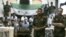 This image made from a video released by the Baraa Brigades and accessed Aug. 5, 2012, purports to show Free Syrian Army soldiers guarding a group of Iranians abducted a day earlier.