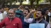 FILE - Indian journalists shout slogans for the freedom of press near Supreme Court in New Delhi, India Tuesday, Feb. 16, 2016.