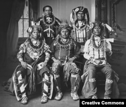 Photo of a delegation of Otoe tribe members wearing traditional claw necklaces and fur hats, during an official visit to Washington, D.C., in 1881.