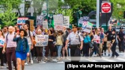 Hundreds of people protest in New York City on June 1, 2017 after President Trump declared that the U.S. is withdrawing from the Paris climate agreement. (Photo by Michael Nigro/Sipa via AP Images))