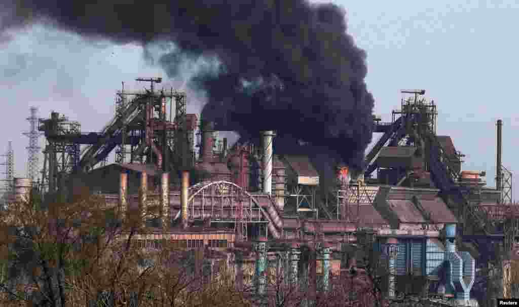 FILE PHOTO: Smoke rises above a plant of Azovstal Iron and Steel Works in Mariupol