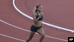 United States runner Sanya Richards-Ross trains for the 2012 Summer Olympics, July 23, 2012, in Birmingham, England.