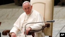 Pope Francis attends his weekly general audience in the Paul VI hall, at the Vatican, Aug. 20, 2014.