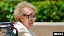 FILE - Former first lady of the United States Nancy Reagan visits the grave site of her husband, former United States President Ronald Reagan, on the 10th anniversary of his passing, in Simi Valley, California June 5, 2014. 