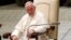 Pope Francis attends his weekly general audience in the Paul VI hall, at the Vatican, Aug. 20, 2014.