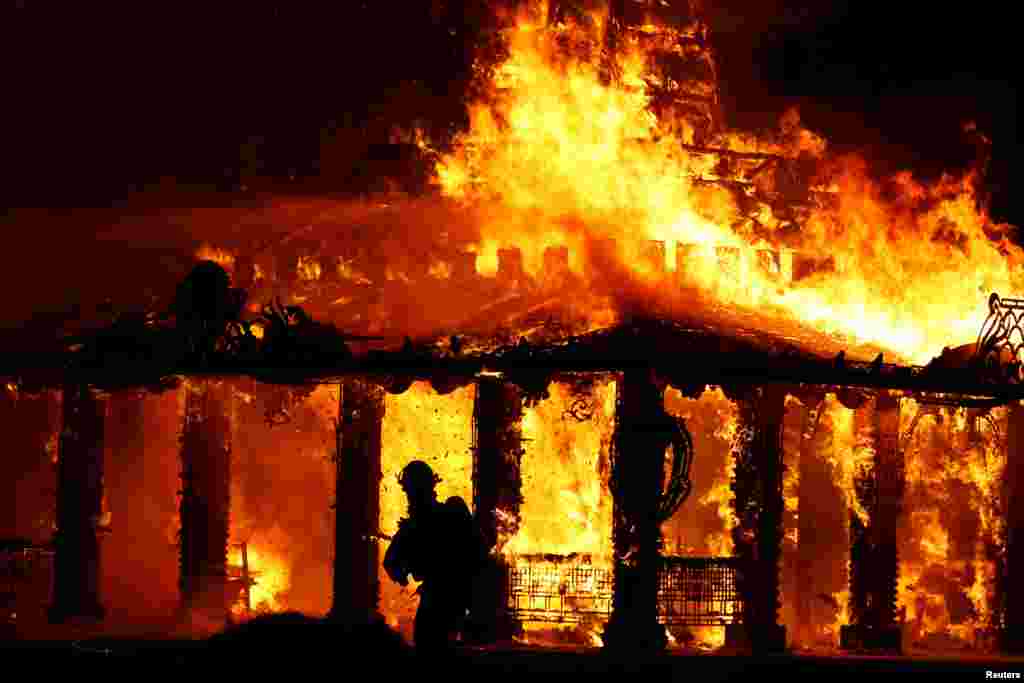 The &#39;Temple of Time&#39;, a structure built to serve as a healing place for those affected by the shooting at nearby Marjory Stoneman Douglas High School, is burned in a ceremonial fire in Coral Springs, Florida, May 19, 2019.