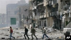 A boy stands as the faithful attend prayers for the Muslim Eid al-Fitr holiday, which marks the end of the fasting month of Ramadan, in Palermo, Italy, August 8, 2013.&nbsp;