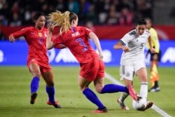On Feb 7, 2020 in Los Angeles, California, USA; Mexico defender Jimena Lopez (5) passes the ball while US midfielder Samantha Mewis (3) defends during the second half of the CONCACAF Women's Olympic Qualifying soccer tournament.