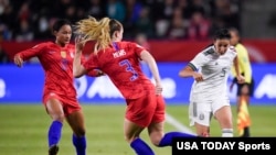 Mexico defender Jimena Lopez (5) passes the ball while U.S. midfielder Samantha Mewis (3) defends during the second half of the CONCACAF Women's Olympic Qualifying soccer tournament, Feb. 7, 2020, at Dignity Health Sports Park, Los Angeles, Calif.