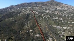 Aerial picture taken with a drone of the urban fencing on the border between the U.S. and Mexico in Tecate, northwestern Mexico, Jan. 26, 2017.