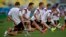 Germany's Miroslav Klose, 2nd from left, stretches during an official training session one day before the World Cup quarterfinal soccer match between Germany and France at Maracana Stadium in Rio de Janeiro, Brazil, July 3, 2014.