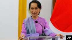 FILE - Myanmar's State Counselor and Foreign Minister Aung San Suu Kyi speaks to the media during a joint press conference with Japanese Foreign Minister Taro Kono at the Ministry of Foreign Affairs in Naypyitaw, Jan. 12, 2018.