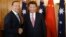 Chinese President Xi Jinping, right, and Australian Prime Minister Tony Abbott shake hands at the start of their bilateral meeting in Parliament House in Canberra Monday, Nov. 17, 2014. Xi is continuing his visit to Australia following the G-20 summit. (A