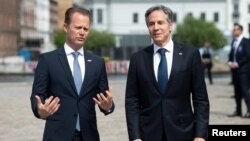 Danish Foreign Minister Jeppe Kofod stands next to U.S. Secretary of State Antony Blinken as he arrives for meetings at the Danish Ministry of Foreign Affairs, Eigtveds Pakhus, in Copenhagen, Denmark, May 17, 2021.