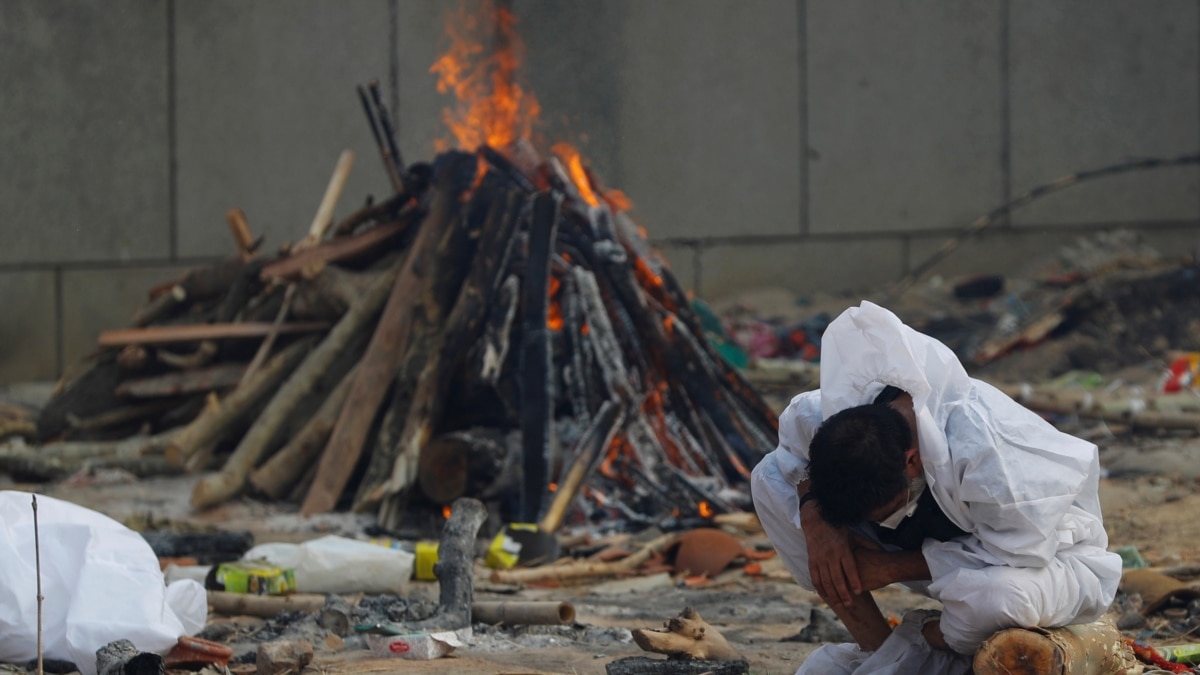 Flames Rise from Funeral Pyres as Indian Families Mourn COVID Victims