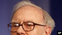Billionaire investor Warren Buffett gestures at a press conference in New Delhi, India, March 24, 2011.