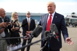 U.S. President Donald Trump speaks to reporters as he boards Air Force One for travel to New Hampshire from Morristown Municipal Airport in Morristown, New Jersey, Aug. 15, 2019.